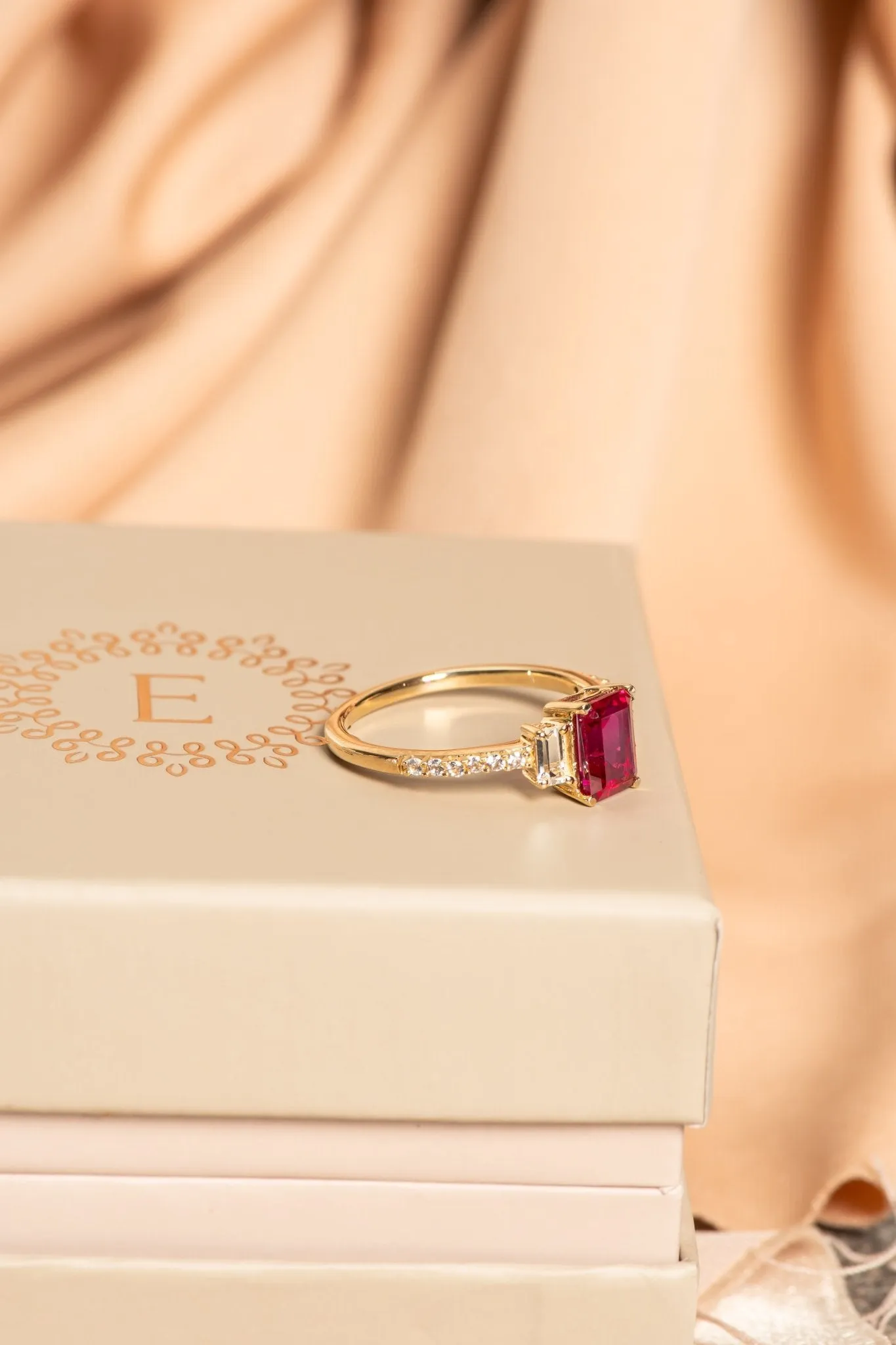 Three Stone Emerald Cut Ruby Ring with White Sapphire Band